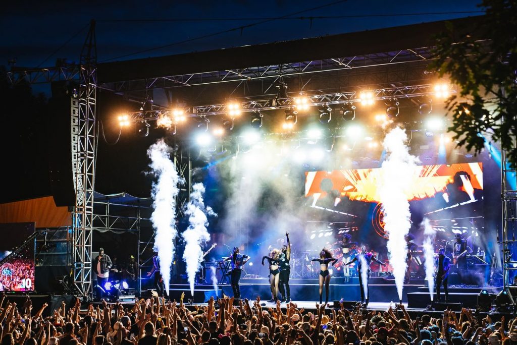 a stage with dancers and fireworks and smoke in philadelphia